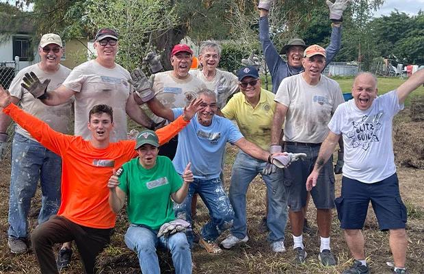 Members of the Knights of Columbus participating in a charitable event, helping the community through acts of service and compassion.